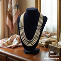 Multi-Strand Pearl Necklace With Filigree Clasp
